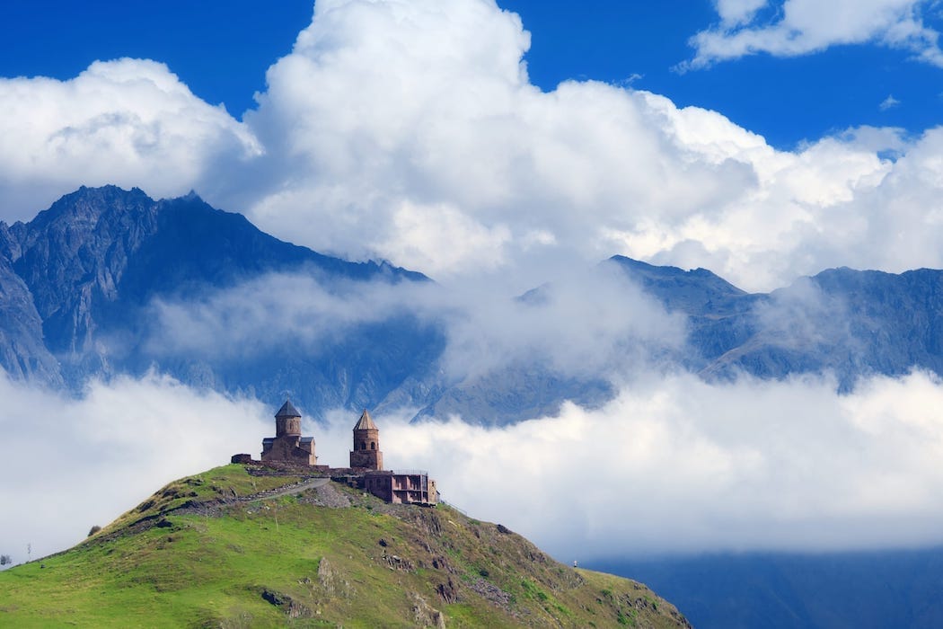 Luxury Georgia holidays. Unmissable sights and experiences in Georgia -Gergeti Trinity Church, Kazbegi DT 45511756