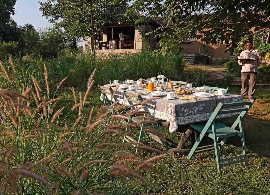 The Sarai at Toria Khajuraho India (Breakfast table in the garden) 1