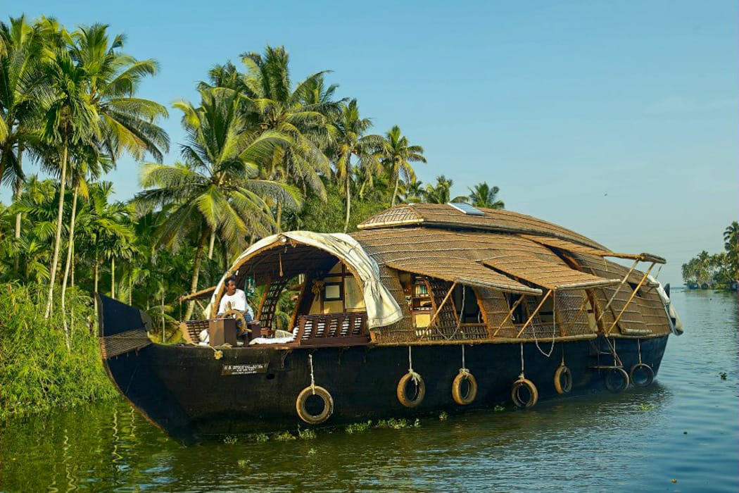 Drift through Kerala's backwaters on a traditional rice barge in South India (Spice Coast Cruises)